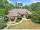 A beautifully landscaped single-Gathering home with a brick exterior and a concrete walkway at 3505 Watson Rd, Cumming, GA 30028