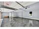 Spacious garage with ample room for vehicles and storage, featuring gray epoxy floors at 3505 Watson Rd, Cumming, GA 30028