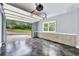 Garage with an open door to a driveway overlooking a landscaped lawn and wooded backdrop at 3505 Watson Rd, Cumming, GA 30028