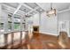 Large living room featuring hardwood floors, a fireplace, and coffered ceiling at 3505 Watson Rd, Cumming, GA 30028