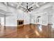 Spacious living room with a fireplace, coffered ceiling, and natural light at 3505 Watson Rd, Cumming, GA 30028