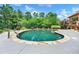 Inviting in-ground pool surrounded by lush landscaping, offering a private outdoor retreat at 3505 Watson Rd, Cumming, GA 30028