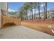 Private backyard with wooden fence and open grassy area at 438 Lantern Wood Dr, Scottdale, GA 30079