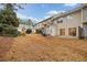 Townhome backyard with patio and view of neighboring homes at 438 Lantern Wood Dr, Scottdale, GA 30079