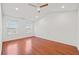 Bright bedroom with hardwood floors and ceiling fan at 438 Lantern Wood Dr, Scottdale, GA 30079