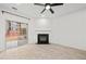 Living room with fireplace, sliding glass doors, and wood-look flooring at 438 Lantern Wood Dr, Scottdale, GA 30079