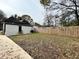 Large backyard enclosed by a tall wooden fence, offering plenty of space for activities at 701 Cameron M Alexander Nw Blvd, Atlanta, GA 30318