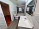 Bathroom featuring bath and shower, vanity and wood look flooring at 701 Cameron M Alexander Nw Blvd, Atlanta, GA 30318