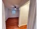 Bedroom featuring wood floors, a ceiling fan, and a closet at 701 Cameron M Alexander Nw Blvd, Atlanta, GA 30318