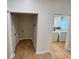 Hallway with wood flooring that flows into laundry room featuring washer and dryer at 701 Cameron M Alexander Nw Blvd, Atlanta, GA 30318