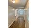 Bright hallway with hard floors and natural light, leading to various rooms of the house at 701 Cameron M Alexander Nw Blvd, Atlanta, GA 30318