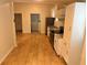 Kitchen view, with cabinets and countertops, oven, sink, fridge, and wood look flooring at 701 Cameron M Alexander Nw Blvd, Atlanta, GA 30318