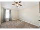 Bright and airy bedroom with ceiling fan and large window at 1590 Walking Horse Trl, Cumming, GA 30041