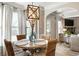 Breakfast nook with a farmhouse table and wicker chairs at 1590 Walking Horse Trl, Cumming, GA 30041