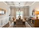 Elegant dining room with hardwood floors and chandelier at 1590 Walking Horse Trl, Cumming, GA 30041