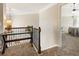 Upstairs hallway with glass-top console table at 1590 Walking Horse Trl, Cumming, GA 30041