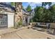 Back patio with stone fireplace, bench seating, and easy access to home at 250 Lakeview Ne Ave, Atlanta, GA 30305
