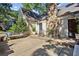 Back patio with stone fireplace, bench seating, and room for entertaining at 250 Lakeview Ne Ave, Atlanta, GA 30305