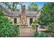 Outdoor patio with stone fireplace and seating area at 250 Lakeview Ne Ave, Atlanta, GA 30305