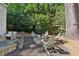 Landscaped backyard with comfortable seating, lush greenery, and a cozy fire pit area for outdoor enjoyment at 250 Lakeview Ne Ave, Atlanta, GA 30305