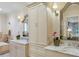 Bright bathroom featuring double sinks with marble countertops, and lots of storage at 250 Lakeview Ne Ave, Atlanta, GA 30305