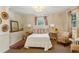 Comfortable bedroom showcasing a queen bed, classic decor, and warm ambient lighting at 250 Lakeview Ne Ave, Atlanta, GA 30305