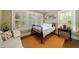 Cozy bedroom featuring hardwood floors and natural light from the window at 250 Lakeview Ne Ave, Atlanta, GA 30305