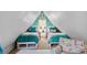 Charming attic bedroom with twin beds, a peace sign decoration, and bright, cheerful decor at 250 Lakeview Ne Ave, Atlanta, GA 30305