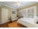 Bedroom with hardwood floors and bright white shutters at 250 Lakeview Ne Ave, Atlanta, GA 30305