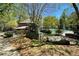 The neighborhood sign welcomes residents to the community pool, set among lush trees at 250 Lakeview Ne Ave, Atlanta, GA 30305