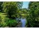 Picturesque creek with dense green foliage on either side, perfect for nature lovers at 250 Lakeview Ne Ave, Atlanta, GA 30305