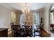 Inviting dining room with modern chandelier and beautiful hardwood floors at 250 Lakeview Ne Ave, Atlanta, GA 30305