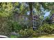 Charming home exterior with mature landscaping, a screened porch, and beautiful hydrangeas at 250 Lakeview Ne Ave, Atlanta, GA 30305