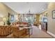 Elegant living room with large windows, hardwood floors, stylish furniture and a decorative chandelier at 250 Lakeview Ne Ave, Atlanta, GA 30305