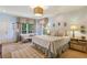 Sunlit main bedroom with neutral tones, charming decor, sitting area and great lighting at 250 Lakeview Ne Ave, Atlanta, GA 30305