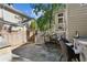 Inviting outdoor patio with built-in grill and stairs to a deck at 250 Lakeview Ne Ave, Atlanta, GA 30305