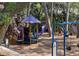 Fun and colorful playground with slides, swings, and climbing structures surrounded by trees at 250 Lakeview Ne Ave, Atlanta, GA 30305