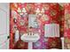 Eye catching powder room featuring patterned wallpaper and pedestal sink at 250 Lakeview Ne Ave, Atlanta, GA 30305