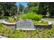 Stone monument sign for Historic Garden Hills Est. 1925, surrounded by manicured landscaping at 250 Lakeview Ne Ave, Atlanta, GA 30305