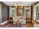 Comfortable sitting room featuring hardwood floors, two large windows, and elegant decor at 250 Lakeview Ne Ave, Atlanta, GA 30305