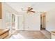 Bright dining space with wood floors and sliding door access to the backyard deck at 3212 Huxley Ct, Duluth, GA 30096