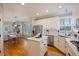 Modern kitchen with white cabinets and stainless steel appliances at 412 Mallory Cir, Loganville, GA 30052