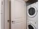 In-unit laundry with a stacked washer and dryer at 44 Peachtree Ne Pl # 1622, Atlanta, GA 30309