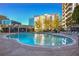 Community swimming pool with plenty of lounge chairs at 44 Peachtree Ne Pl # 1622, Atlanta, GA 30309