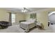 Cozy bedroom with a comfortable bed, window, and ceiling fan at 4503 Mulberry Fields Ln, Auburn, GA 30011