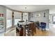 Casual dining area with hardwood floors, and a square wooden table with seating for four at 4503 Mulberry Fields Ln, Auburn, GA 30011