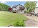 House exterior with deck, steps, and lush green lawn at 4503 Mulberry Fields Ln, Auburn, GA 30011