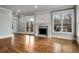 Bright living room with hardwood floors, fireplace, and french doors leading to deck at 1271 Fenway Cir, Decatur, GA 30030