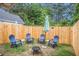 Private backyard with fire pit and seating area at 145 Gentle Breeze Ct, Temple, GA 30179