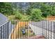 Private backyard with patio furniture and wooded area at 145 Gentle Breeze Ct, Temple, GA 30179